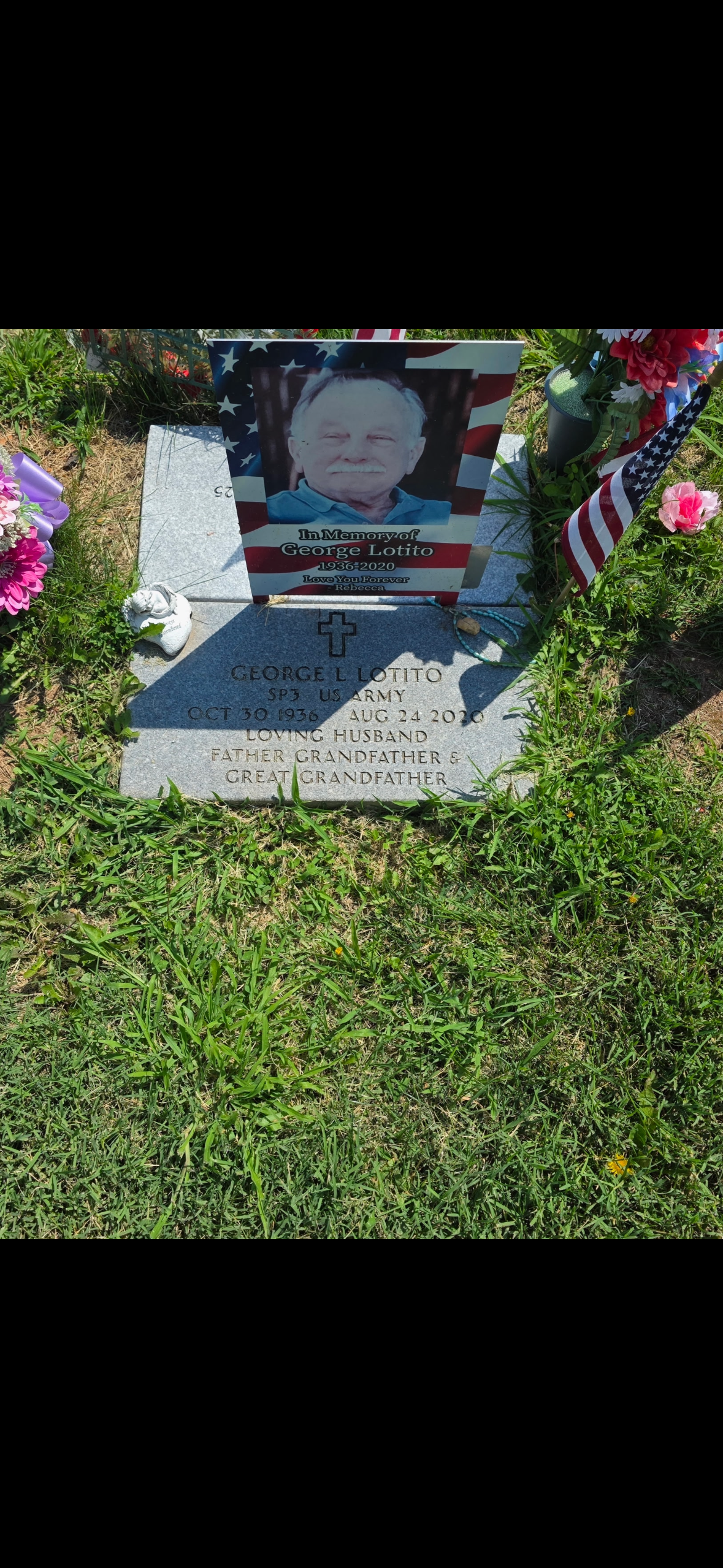Headstone before cleaning — weathered and covered in moss